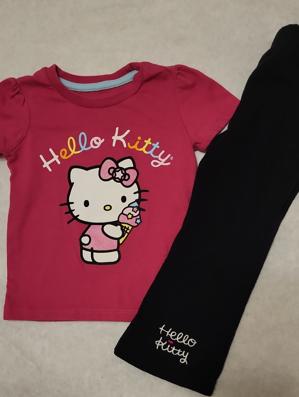 Hello Kitty pink tee shirt & black flared leggings